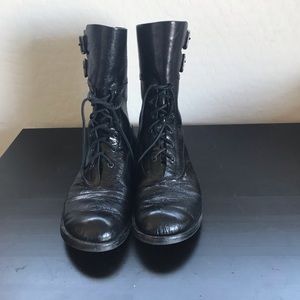 Black lace up combat boots.